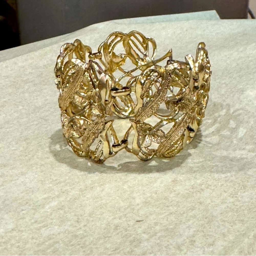 Gold tone floral brocade statement cuff bracelet